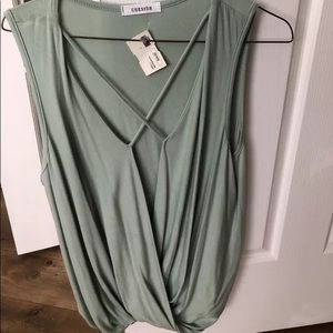 Criss cross sage sleeveless shirt